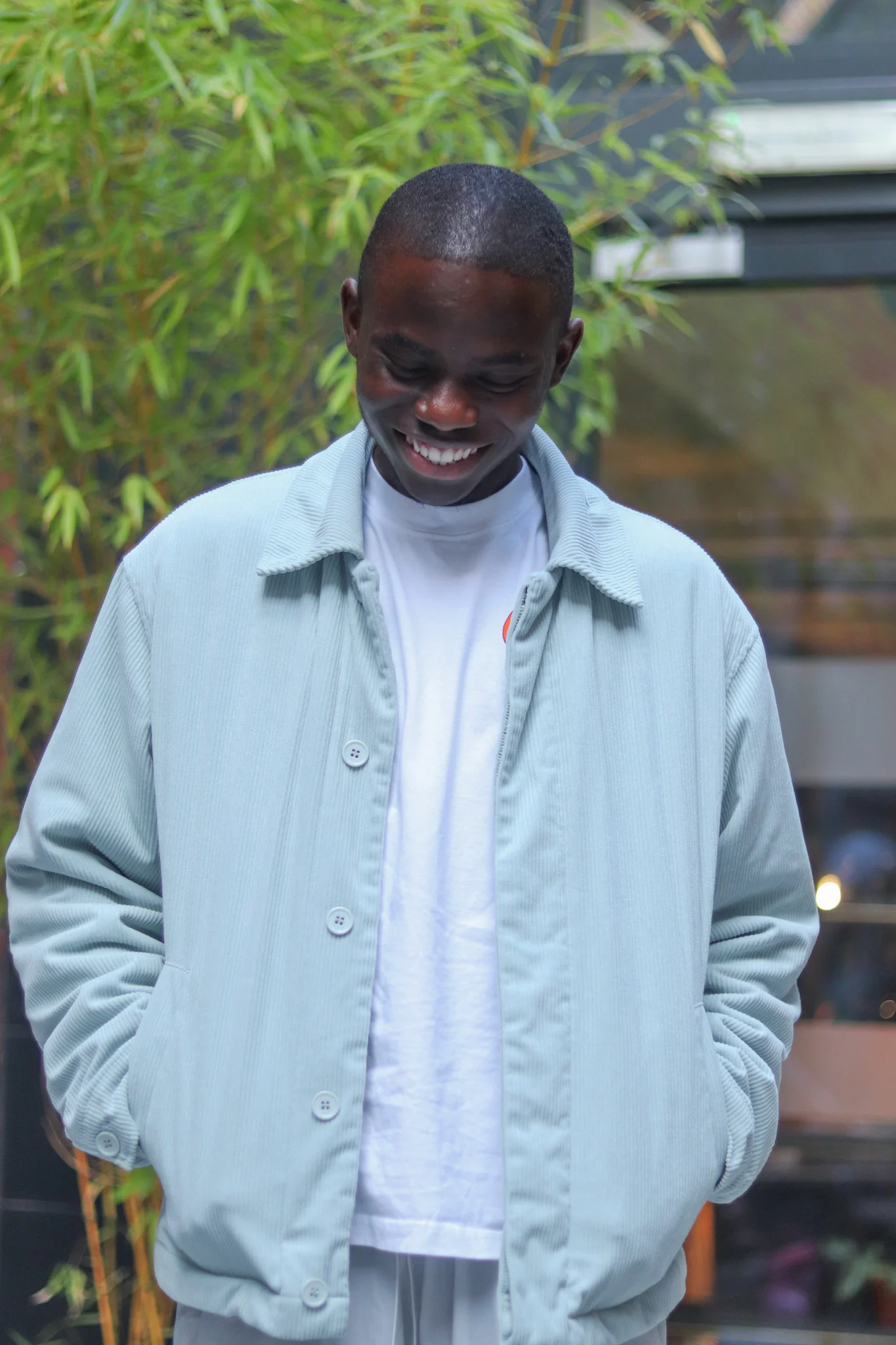 black guy with sky blue jacket