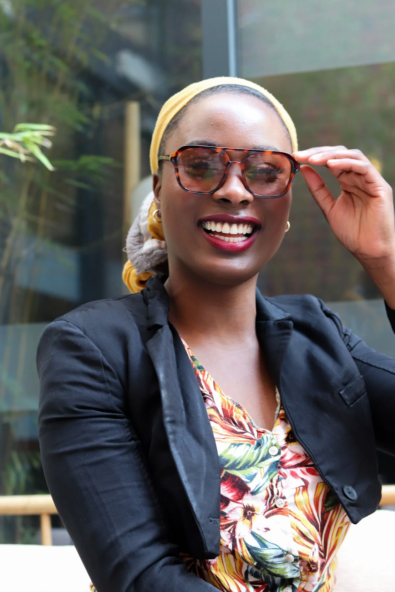 black girl smiling with a doek on