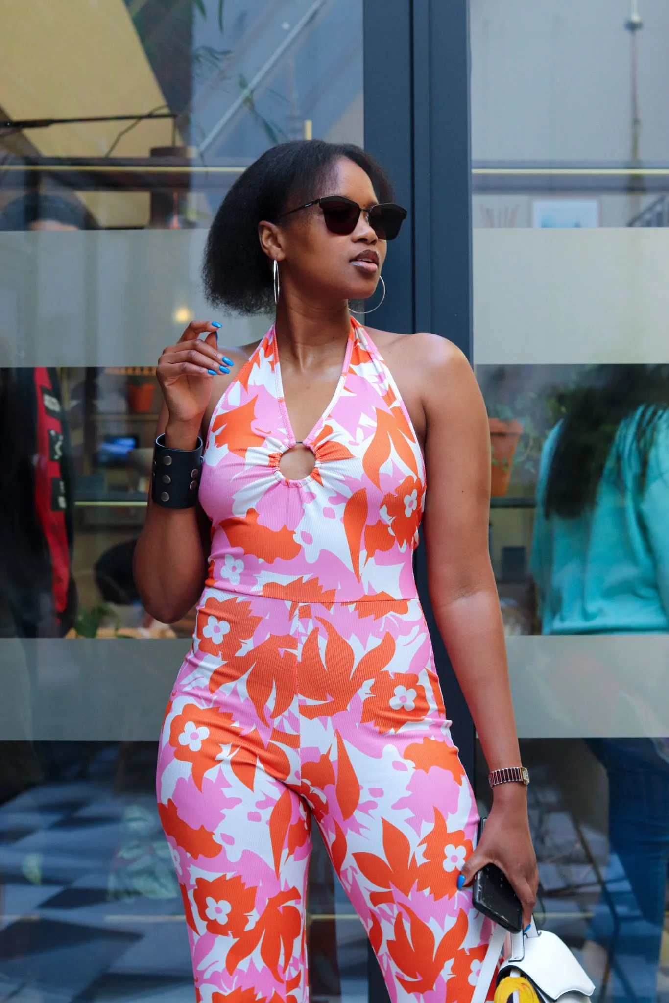 black girl with flowered jumpsuit