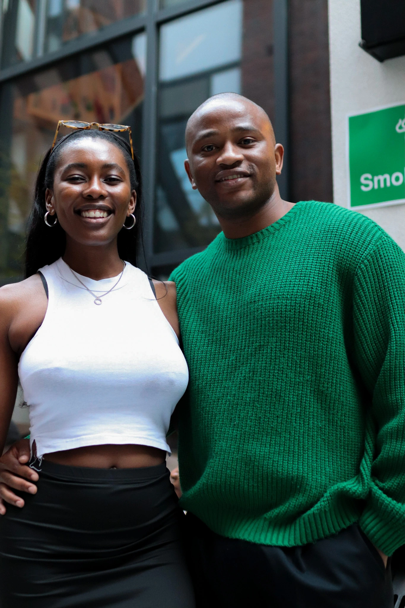 black girl and black guy standing next to each other