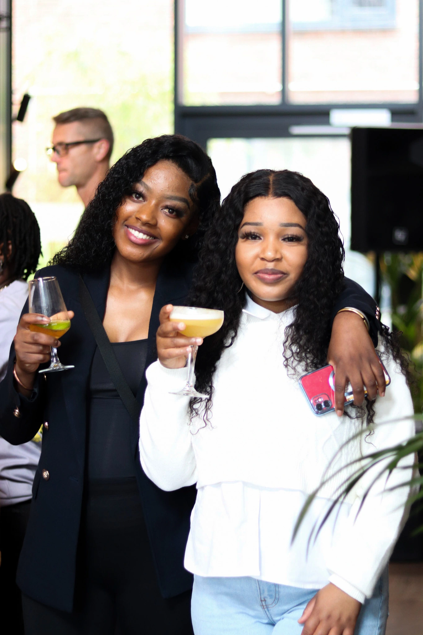two black girls with drinks in hand